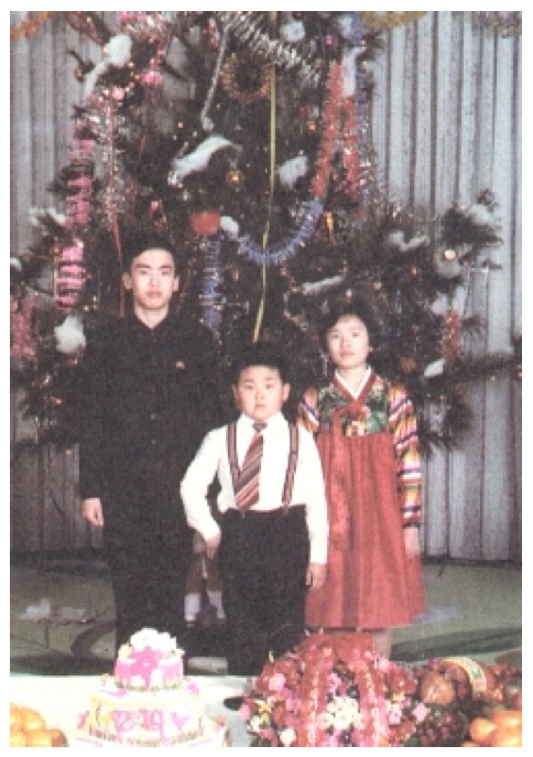Kim Jong Nam brandishing a gold pistol, with his maternal cousins, at a party celebrating Kim Jong Il's birthday in 1979