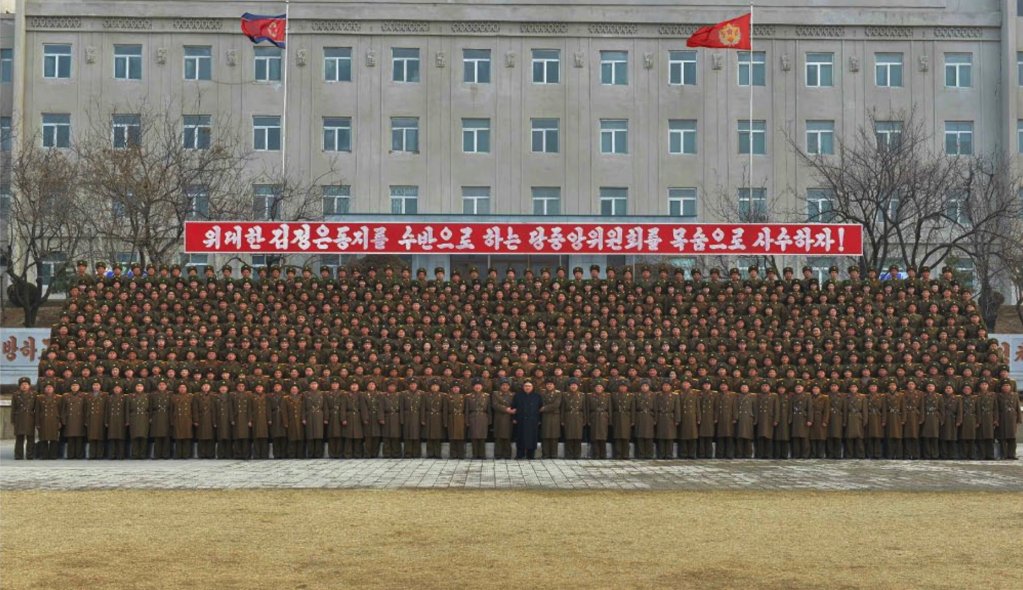 Kim Jong Un poses for a commemorative photo with command staff, service members and officers of KPA Large Combined Unit #966 in a photo which appeared on top-center of the front page of the March 1, 2017 edition of the WPK daily organ Rodong Sinmun