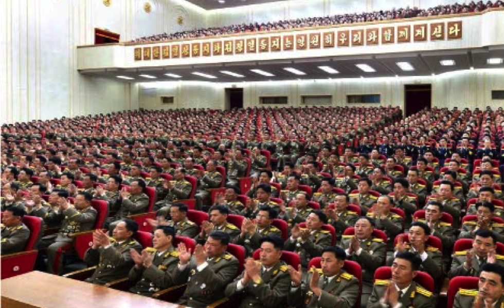 Participants applaud during a February 7, 2017 meeting marking the KPA's historical anniversary. This photo appeared bottom-right on the front page of the February 8, 2017 edition of the WPK daily organ Rodong Sinmun (Photo: Rodong Sinmun/KCNA).